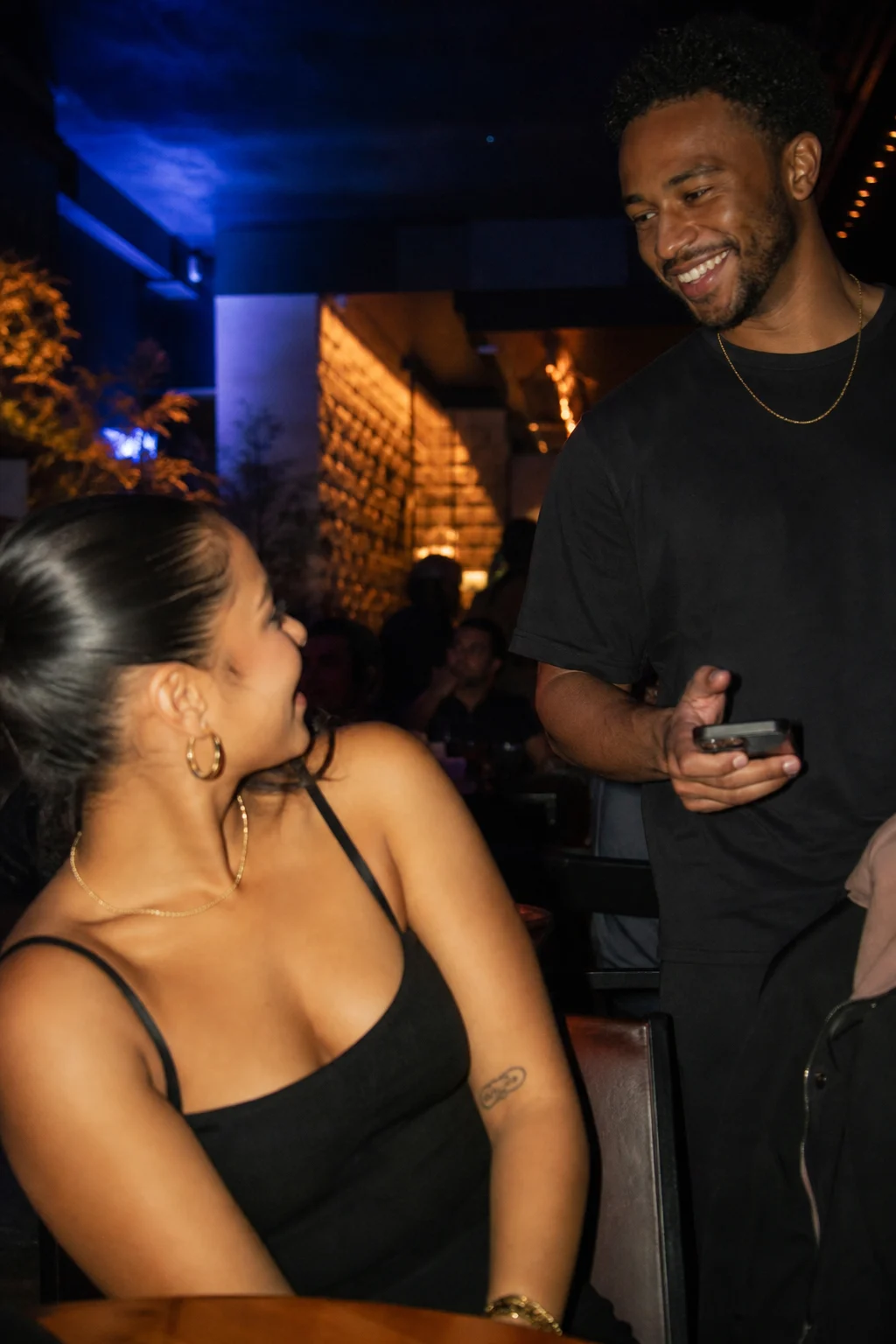 Couple flirting with phone