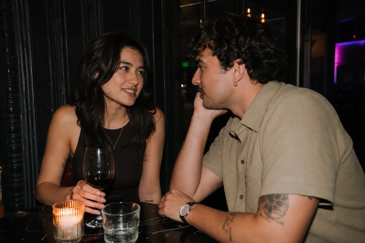 Partners talking over drinks